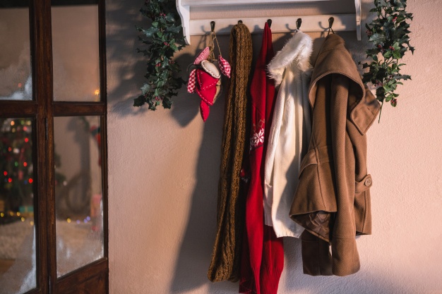 coat rack with hanging winter clothes 1252 418